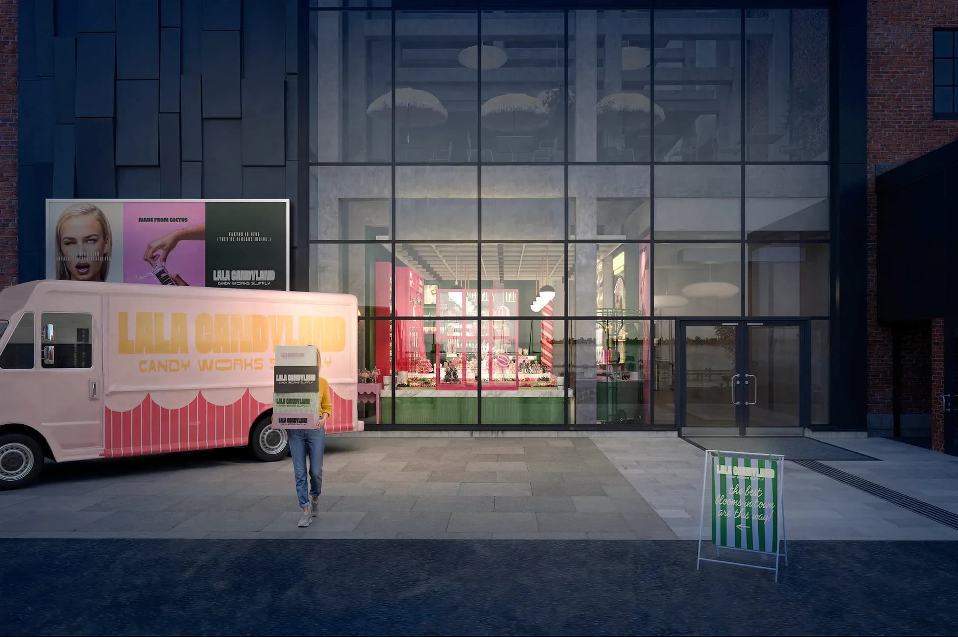 The LaLa Candyland storefront at night: a double-height glass facade glowing with pink and green shelving, a pink candy van parked outside.